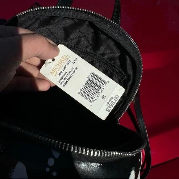 Two Michael Kors backpacks very good condition. Original tags with both bags!